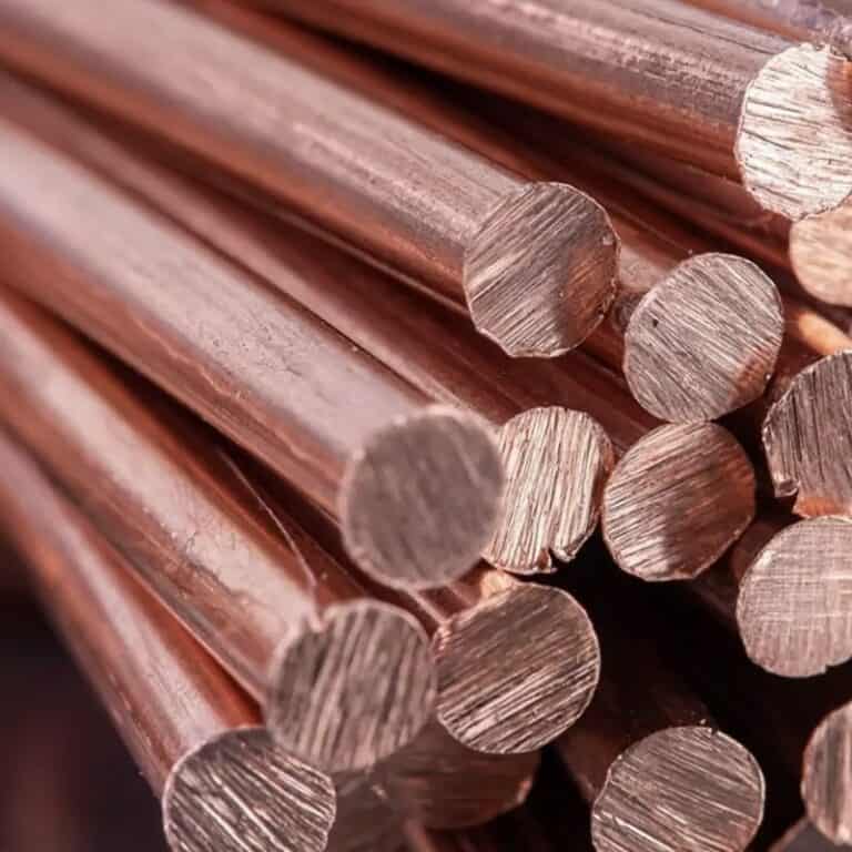 Copper being processed using CNC machines in the mechanical machining industry, including milling and drilling operations.