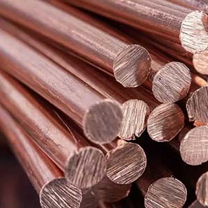 Copper being processed using CNC machines in the mechanical machining industry, including milling and drilling operations.
