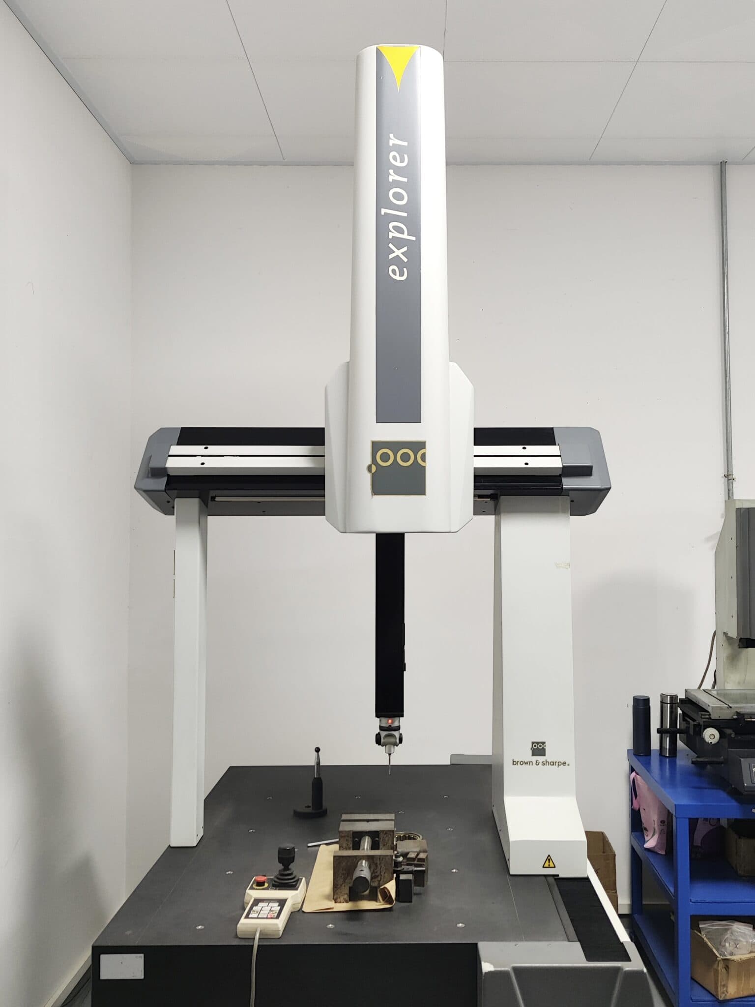 Hexagon Explorer series Coordinate Measuring Machine (CMM) services in the mechanical industry, showing the precise measurement process of workpieces to ensure high - quality manufacturing.