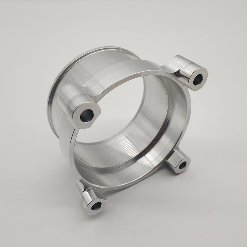 Automotive valve body manufactured by CNC turning, 4-axis CNC milling, and thread tapping or turning, made from 6061-T6 or 7075-T7 aluminum alloy, finished with polishing or anodization.