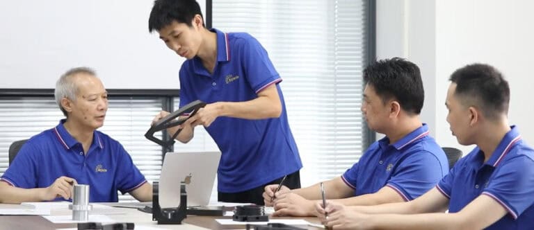 Workers monitoring sand casting processes in a mechanical manufacturing facility, shaping metal components with precision