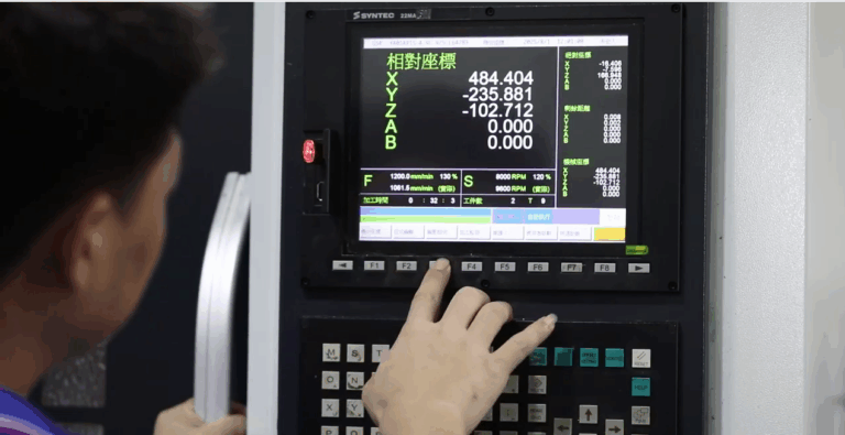 Engineer fine-tuning CNC programming tweaks on a control panel to optimize machining processes in a precision workshop