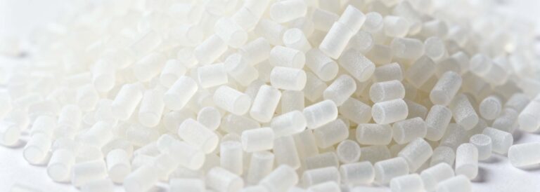 A machine processing polyethylene (PE) material, showing precision cutting in mechanical manufacturing