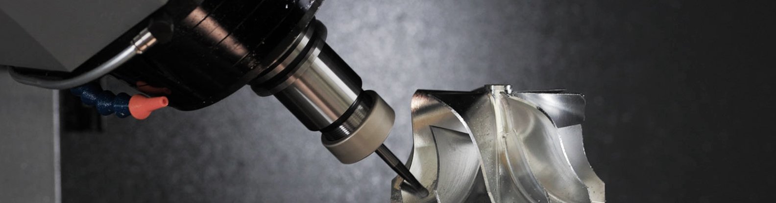 5-axis CNC machine performing precision machining, ideal for complex parts in aerospace and automotive manufacturing. Explains what is a 5 axis CNC machine and its industrial applications.