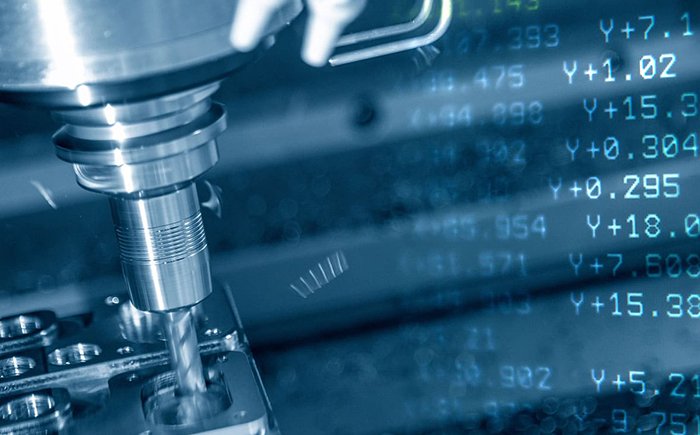 CNC machining process controlled by G-code, showing precision tool path programming for metal cutting and mechanical part manufacturing
