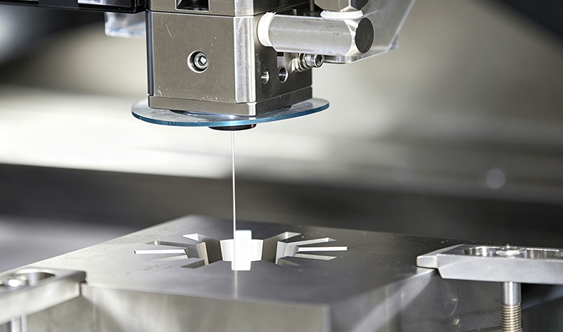 Sinker EDM machine conducting precision cavity machining on metal workpiece for mold and mechanical part manufacturing