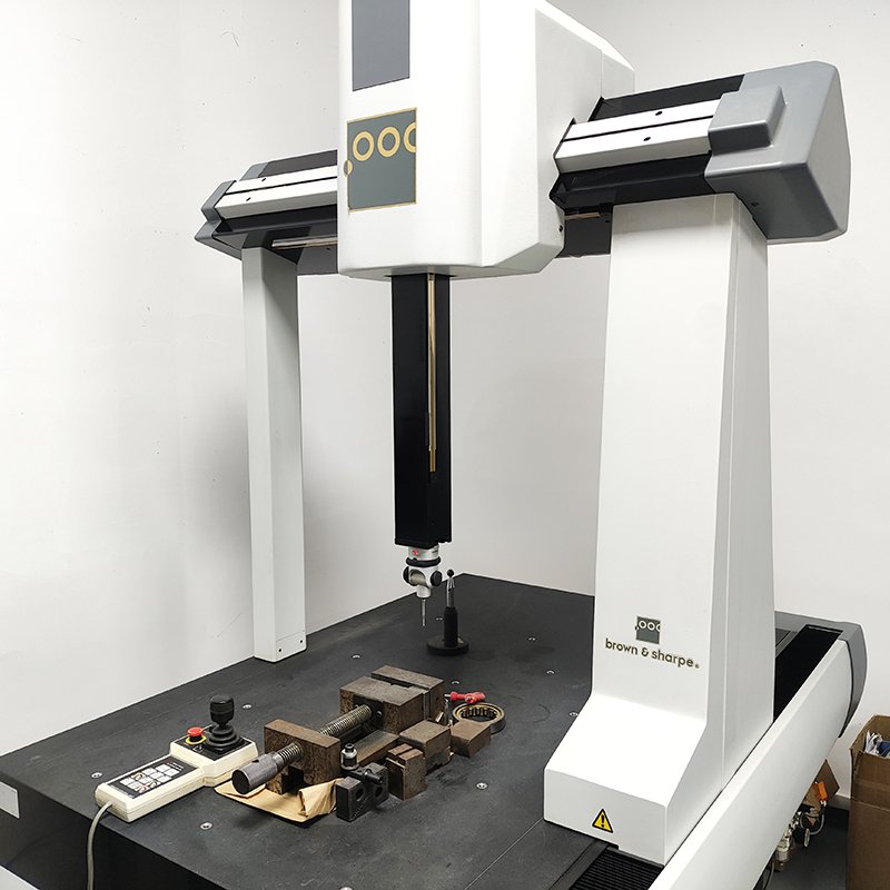 CMM coordinate measuring machine inspecting CNC machined metal part, high-precision dimensional inspection for mechanical manufacturing quality control