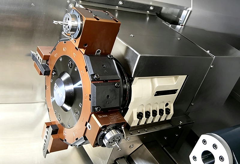 Lathe tooling showing tool post or turret interface for CNC turning. Precision machined metal component for lathe machining operations, industrial mechanical part for metal cutting.