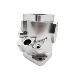 Automotive single valve body manufactured by 5-axis CNC machining, including drilling, tapping, and deburring processes, made from aluminum alloy 6061-T6 with an as-machined finish.