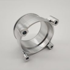 Automotive valve body manufactured by CNC turning, 4-axis CNC milling, and thread tapping or turning, made from 6061-T6 or 7075-T7 aluminum alloy, finished with polishing or anodization.