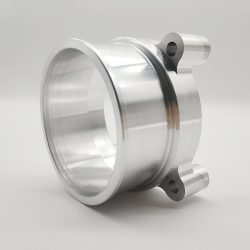 Automotive valve body manufactured using CNC turning, 4-axis CNC milling, and threading operations, crafted from 6061-T6 or 7075-T7 aluminum alloy, finished with polishing or anodization for automotive applications.
