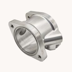 Automotive valve body fabricated using 5-axis CNC milling, made from aerospace-grade aluminum alloy (6061-T6 or 7075-T6) with an as-machined finish, designed for automotive applications.