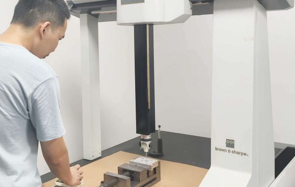 Small-batch machining facility with CNC equipment producing custom metal components